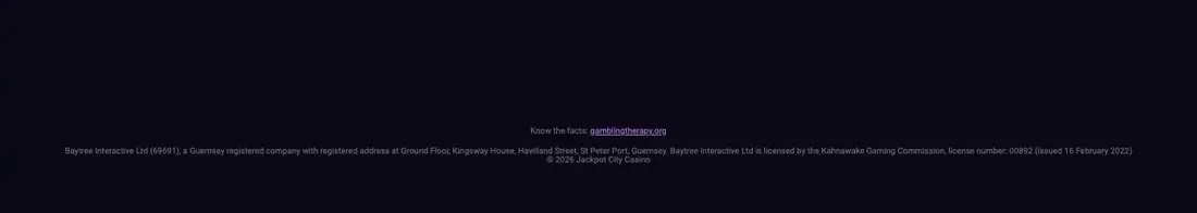 JackpotCity Canadian site footer naming Baytree Interactive Ltd, Guernsey company 69691, licensed by the Kahnawake Gaming Commission, licence 00892